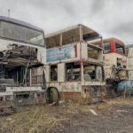 A British explorer uncovers a haunting "bus graveyard" in Yorkshire, filled with decaying double-deckers overtaken by nature in a surreal and eerie discovery.