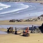 Sun-seekers at Towan Beach in Newquay had their first beach day of 2025 disrupted as construction vehicles rumbled across the sand, sparking frustration among locals.