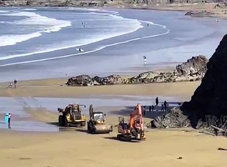 Sun-seekers at Towan Beach in Newquay had their first beach day of 2025 disrupted as construction vehicles rumbled across the sand, sparking frustration among locals.