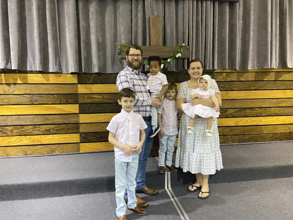 After fostering 17 children and adopting four, a woman who struggled with infertility is now pregnant - a heartwarming journey of love, loss, and a growing family.
