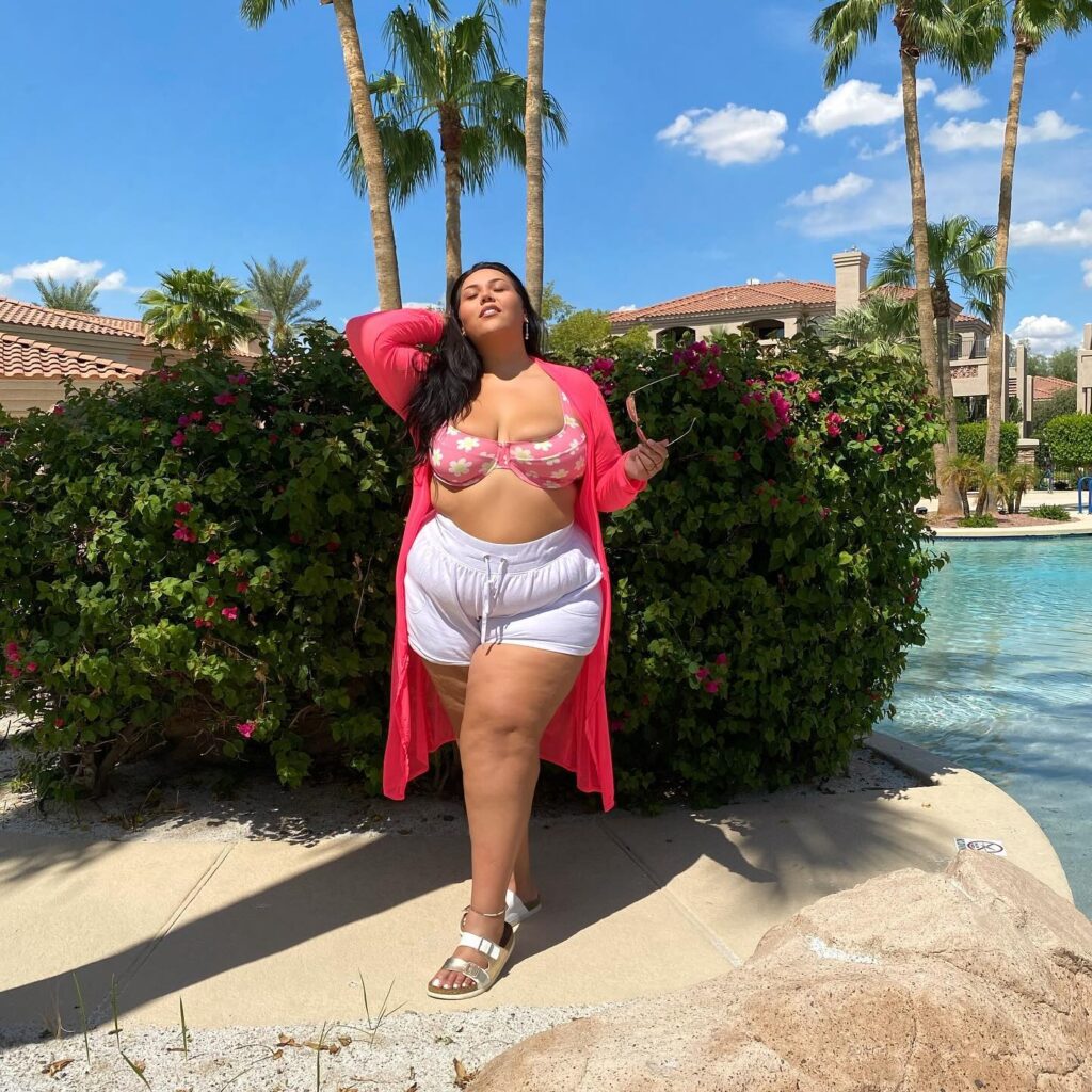 Plus-size influencer Julia Sena, once self-conscious in baggy jumpers, now embraces being "fat and proud," urging others to reject societal pressures and love their bodies.