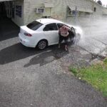 A fed-up business owner installed a motion-triggered sprinkler to drench drivers blocking his driveway in Australia - and the hilarious footage has gone viral.