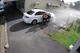 A fed-up business owner installed a motion-triggered sprinkler to drench drivers blocking his driveway in Australia - and the hilarious footage has gone viral.