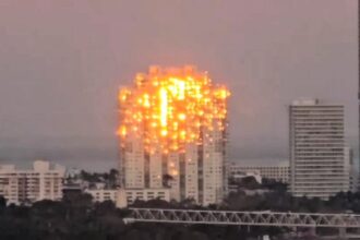 A stunning optical illusion of a ‘burning’ skyscraper in Miami leaves Instagram users baffled - but it’s just the sunset playing tricks with the building’s windows.