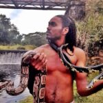 Alexandre Rocha, a real-life Dr. Dolittle, claims he can 'speak' to snakes, calming them with words. The Brazilian animal lover shares his wild encounters online.