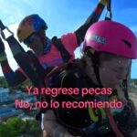 Tourist's paragliding adventure turns into a nightmare as she vomits mid-air, accidentally spraying her instructor - the viral video has left viewers in shock and laughter.