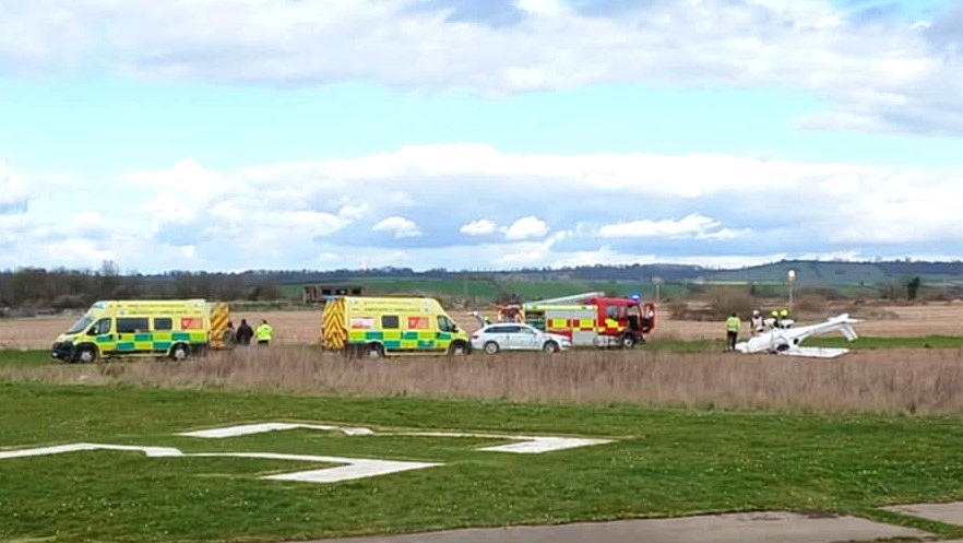 Two people survived with minor injuries after a light aircraft flipped on landing at Westonzoyland Airfield, Somerset, prompting an air safety investigation.