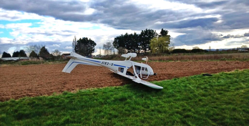 Two people survived with minor injuries after a light aircraft flipped on landing at Westonzoyland Airfield, Somerset, prompting an air safety investigation.