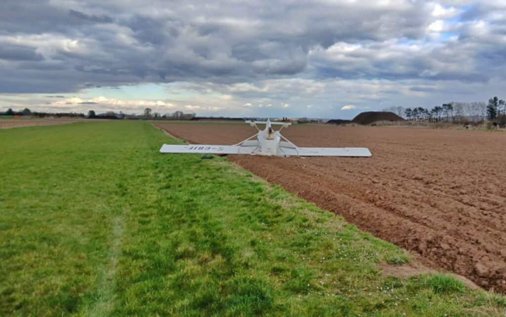 Two people survived with minor injuries after a light aircraft flipped on landing at Westonzoyland Airfield, Somerset, prompting an air safety investigation.