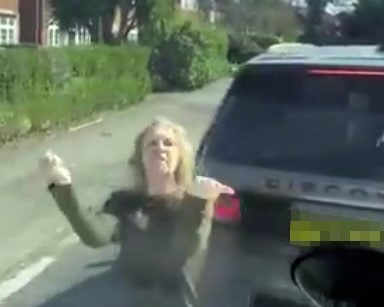 Road rage woman uses iconic Friends-style fist gesture during argument - channels Ross and Monica in bizarre dance and insult after calling driver a n*bhead in Maidenhead.
