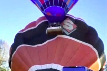 Two hot air balloons collided during takeoff in the Netherlands after a sudden wind shift ripped one apart mid-air, leaving shocked riders clinging on in fear.