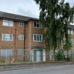 Urban explorer Sean Piper uncovered derelict homes on a deserted Woking estate, abandoned for luxury flats, still filled with personal items from evicted tenants.