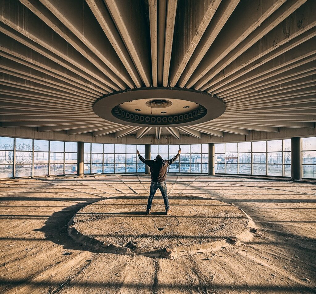 Urban explorer reveals inside abandoned Bugatti factory in Italy - once home to luxury cars, now filled with ruins, paint bottles and a spinning showroom floor.