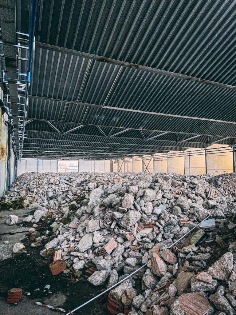 Urban explorer reveals inside abandoned Bugatti factory in Italy - once home to luxury cars, now filled with ruins, paint bottles and a spinning showroom floor.
