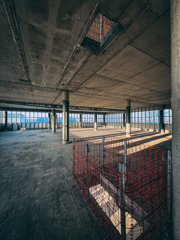 Urban explorer reveals inside abandoned Bugatti factory in Italy - once home to luxury cars, now filled with ruins, paint bottles and a spinning showroom floor.