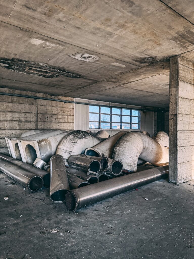 Urban explorer reveals inside abandoned Bugatti factory in Italy - once home to luxury cars, now filled with ruins, paint bottles and a spinning showroom floor.