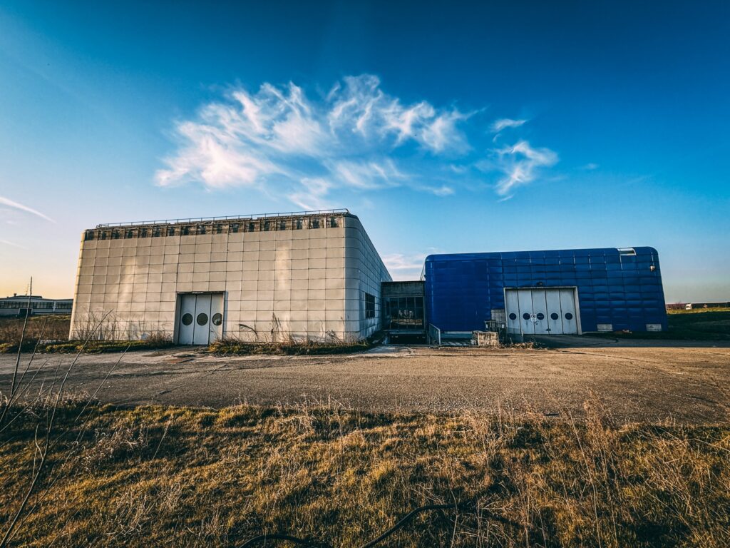 Urban explorer reveals inside abandoned Bugatti factory in Italy - once home to luxury cars, now filled with ruins, paint bottles and a spinning showroom floor.