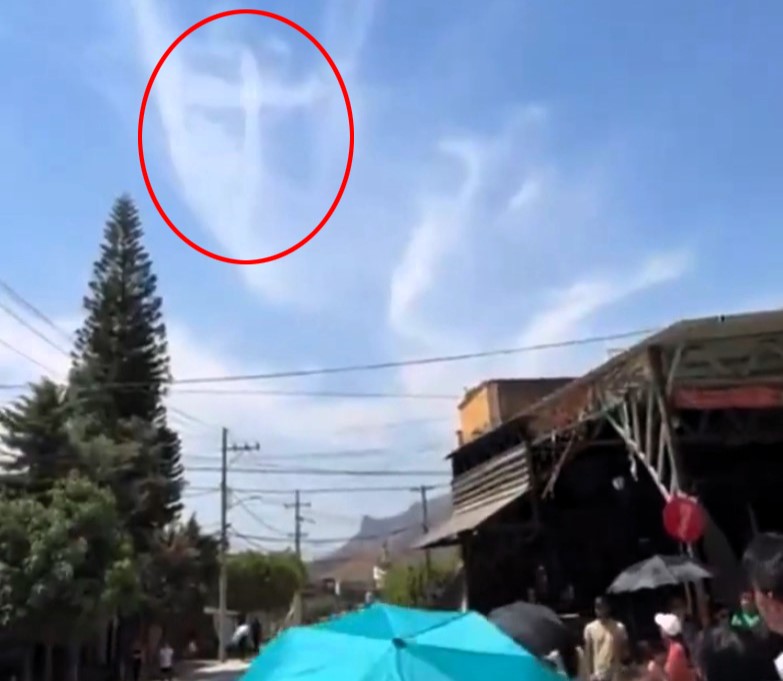 Worshippers stunned as crucifix shape forms in clouds during Easter parade in Mexico - crowd films mysterious sight with some calling it divine, others unconvinced.
