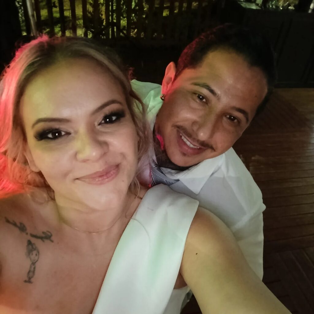 Bride who fell for undertaker attends funerals for two years to get noticed - finally weds him and arrives at ceremony in a hearse with 'Till death do us part' sign.