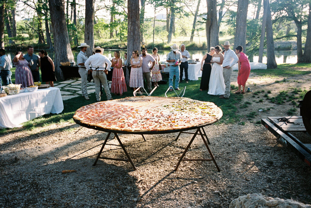 Pizza lovers Beth and Brandon Duhon served an 8ft pie and heart-shaped pizza at their wedding, turning their big day into a cheesy, unforgettable feast for 160 guests.