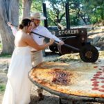 Pizza lovers Beth and Brandon Duhon served an 8ft pie and heart-shaped pizza at their wedding, turning their big day into a cheesy, unforgettable feast for 160 guests.