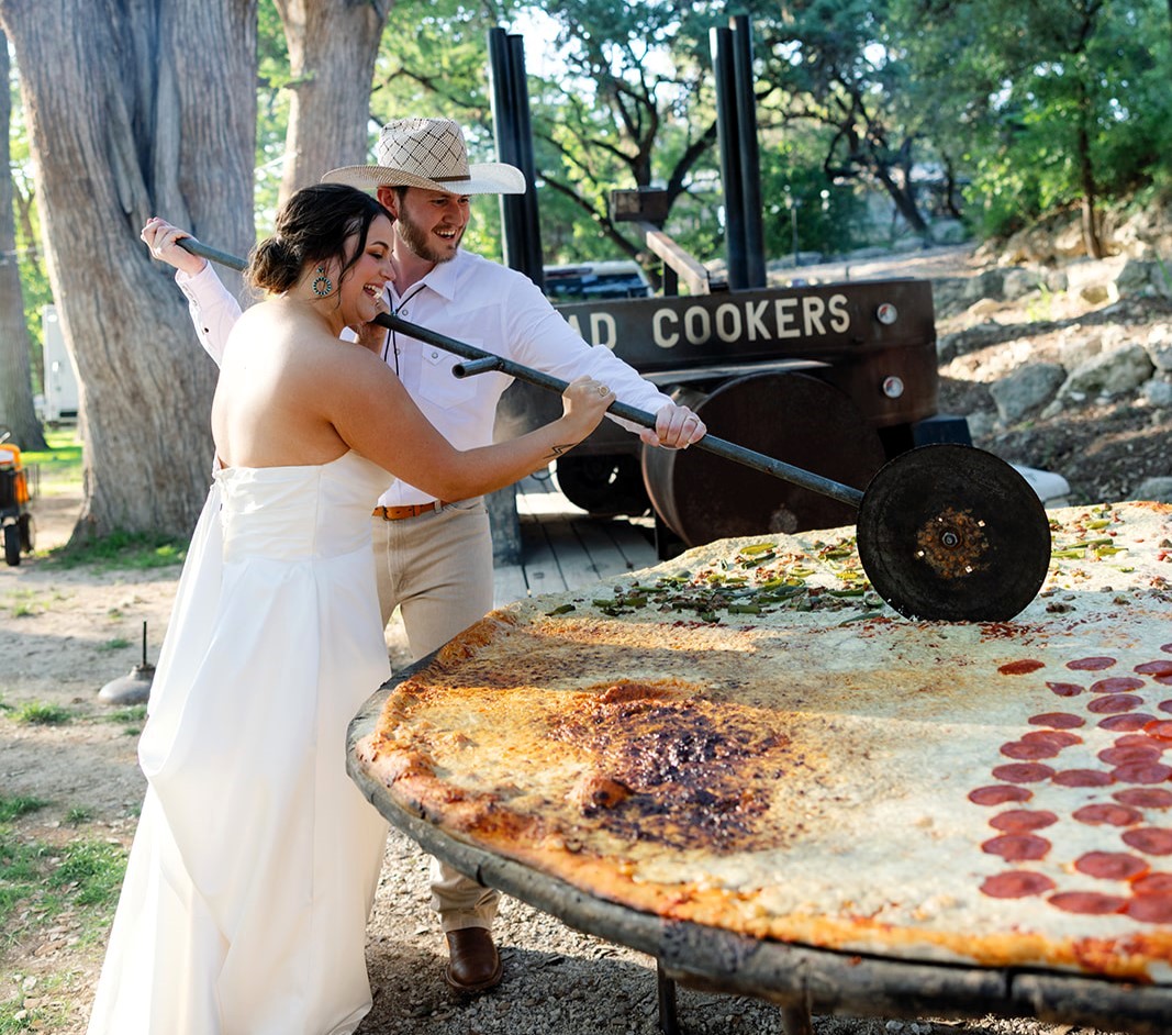 Pizza lovers Beth and Brandon Duhon served an 8ft pie and heart-shaped pizza at their wedding, turning their big day into a cheesy, unforgettable feast for 160 guests.