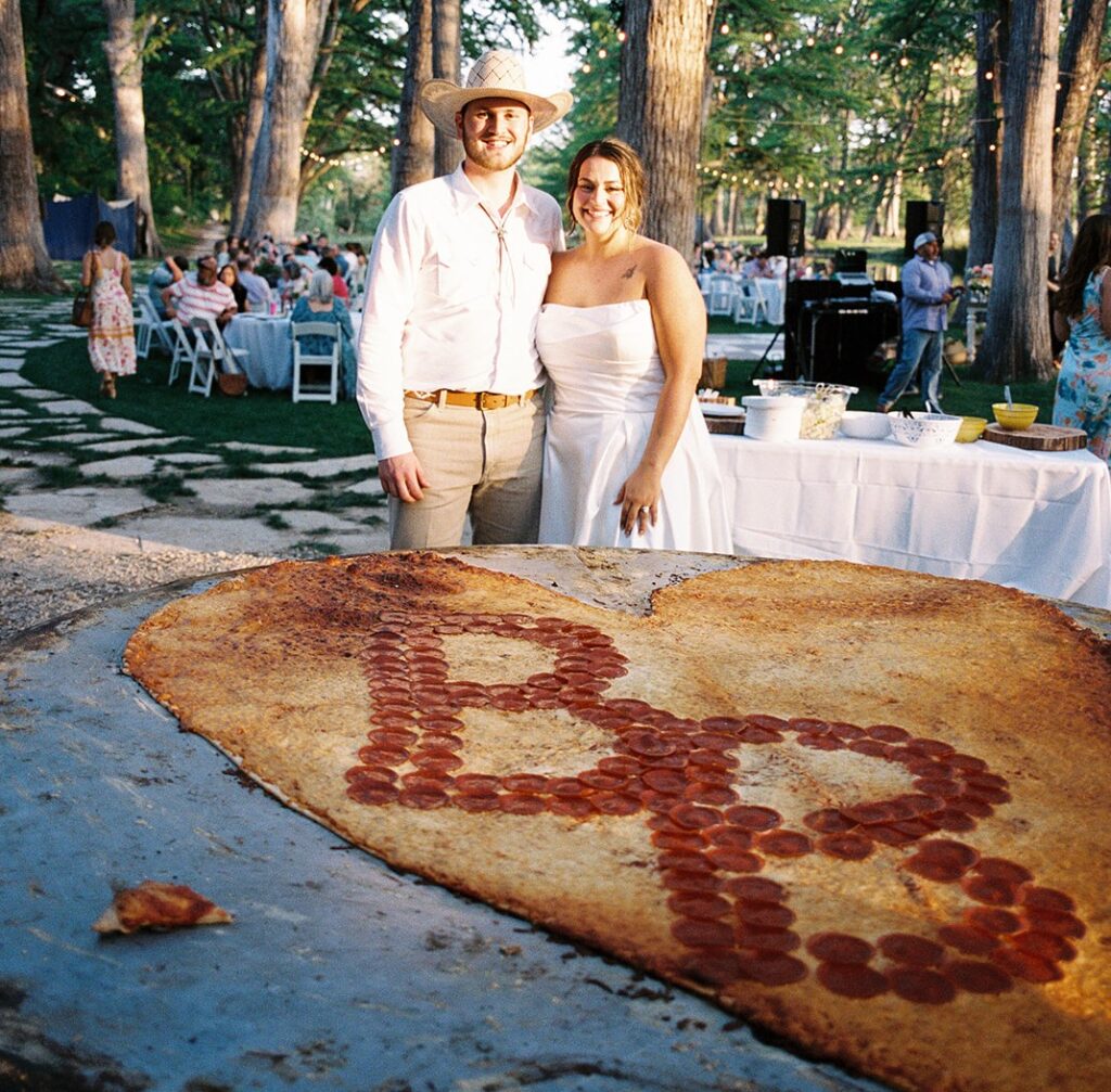 Pizza lovers Beth and Brandon Duhon served an 8ft pie and heart-shaped pizza at their wedding, turning their big day into a cheesy, unforgettable feast for 160 guests.