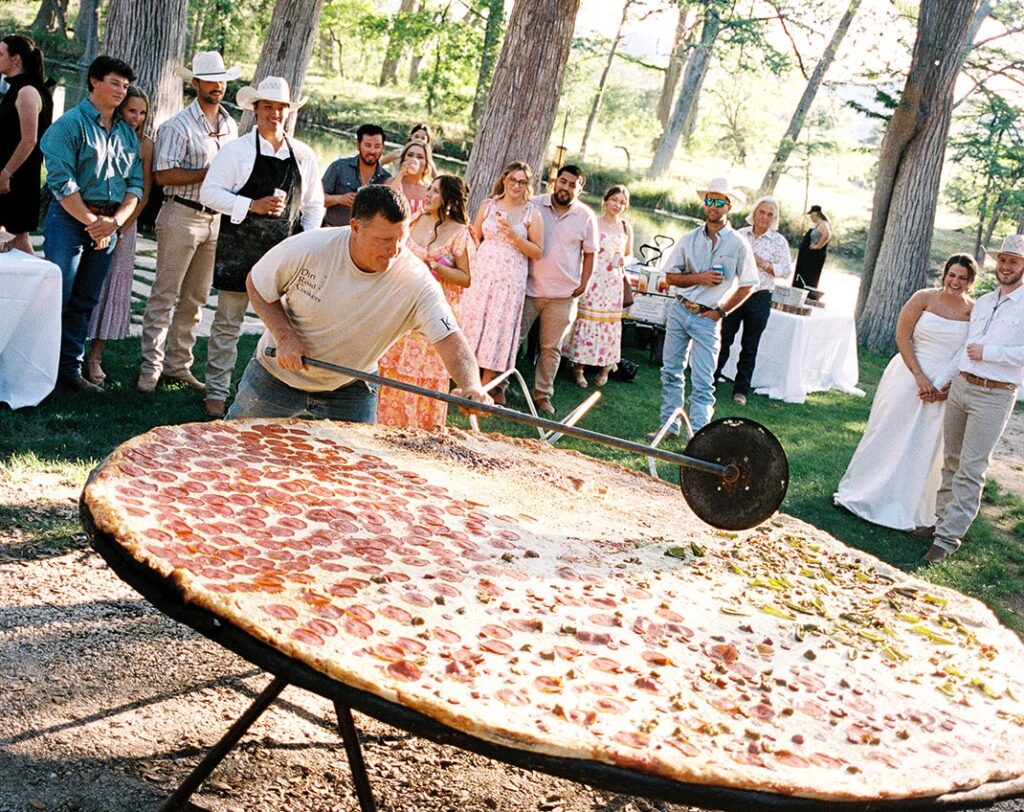Pizza lovers Beth and Brandon Duhon served an 8ft pie and heart-shaped pizza at their wedding, turning their big day into a cheesy, unforgettable feast for 160 guests.