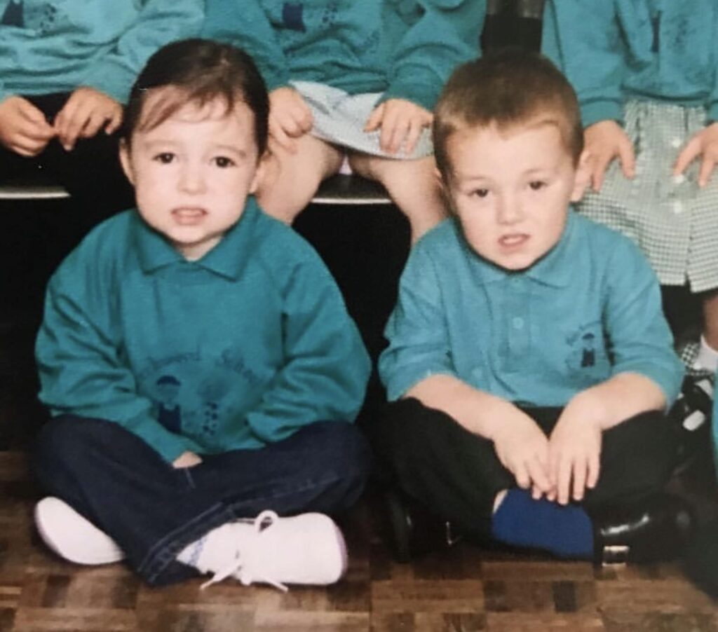 A couple stunned TikTok after discovering a nursery photo of them sitting side by side, seven years into their relationship and now expecting baby number two.