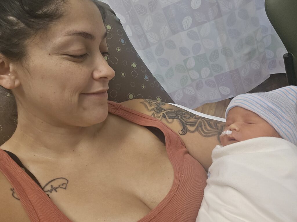 Dad-to-be brings TV and Xbox to hospital for birth, sparking backlash on TikTok - but partner reveals it was all to comfort her, not game, during labour stay.