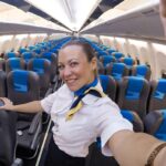 A flight attendant warns travelers not to wear heels, metal accessories or revealing outfits on planes, as they can delay evacuations or get you kicked off.