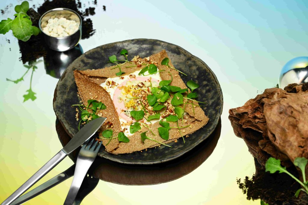 What future meals may look like by 2050 - from 3D printed dishes to kelp noodles and food-growing clothes - as climate change reshapes our diets.
