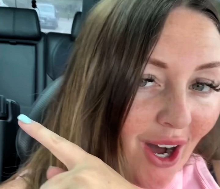 Medium Chloe Smith claims she saw the spirit of an elderly woman in glasses on her car’s back seat outside Tesco - fans say they spotted the ghost in her viral video too.
