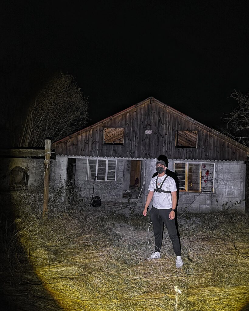 A TikToker exploring a haunted house in Mexico captured a ghostly figure with glowing red eyes on camera, leaving viewers terrified by the chilling encounter.