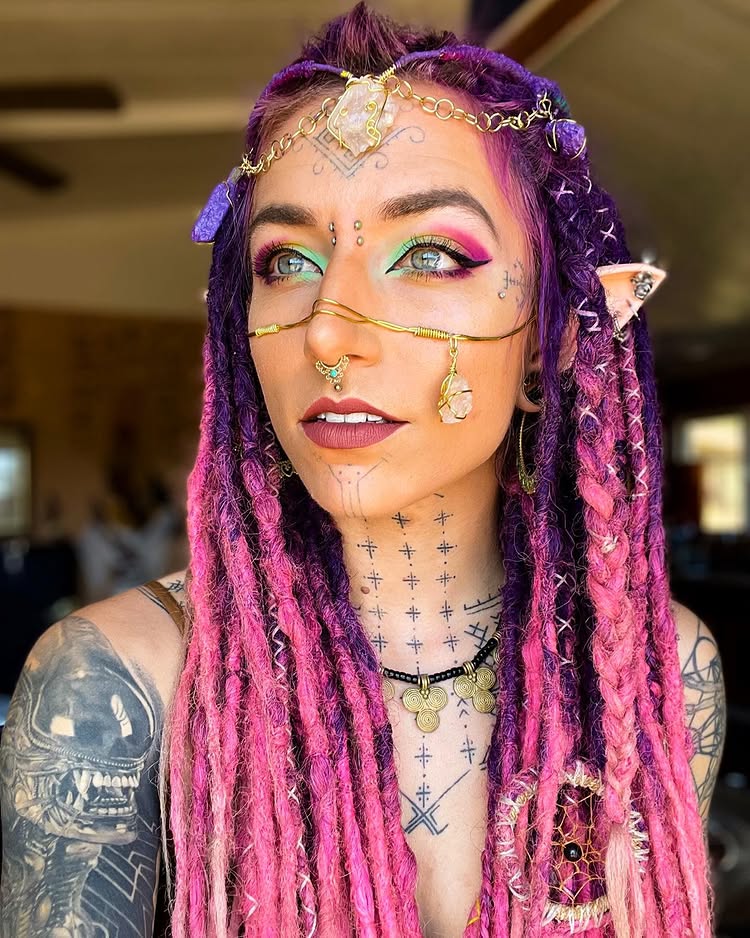 Body mod fan Flower relearned to speak after a painful tongue split, part of her £8.5k transformation including tattoos, piercings, and plans for ear pointing and fangs.