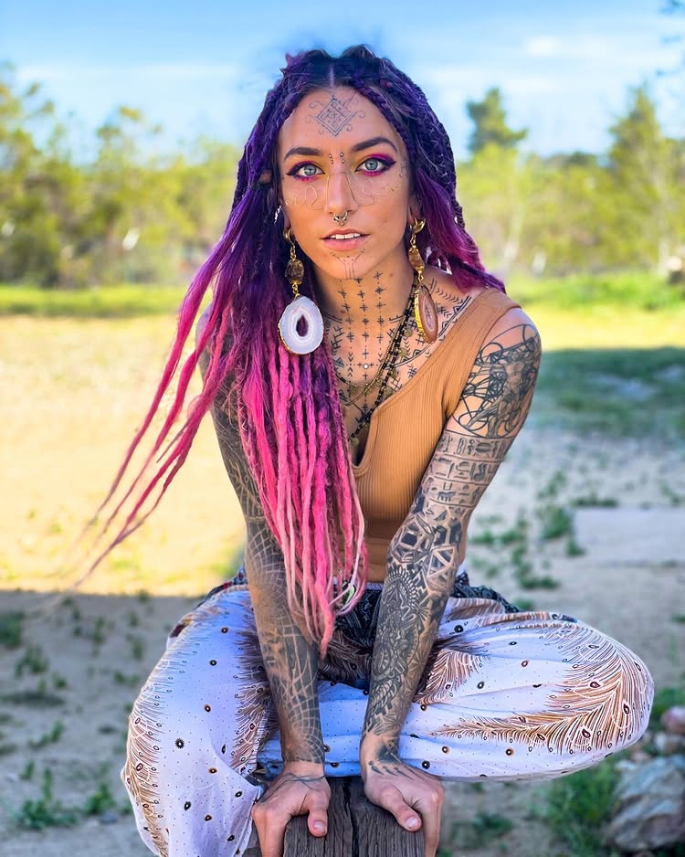 Body mod fan Flower relearned to speak after a painful tongue split, part of her £8.5k transformation including tattoos, piercings, and plans for ear pointing and fangs.