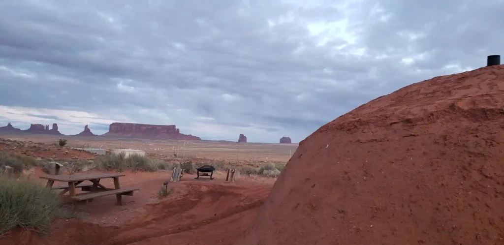 Stay off-grid in a traditional Navajo earthen home in Monument Valley with desert views, native hospitality, and a rustic yet charming experience from just £127 a night.