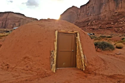 Stay off-grid in a traditional Navajo earthen home in Monument Valley with desert views, native hospitality, and a rustic yet charming experience from just £127 a night.