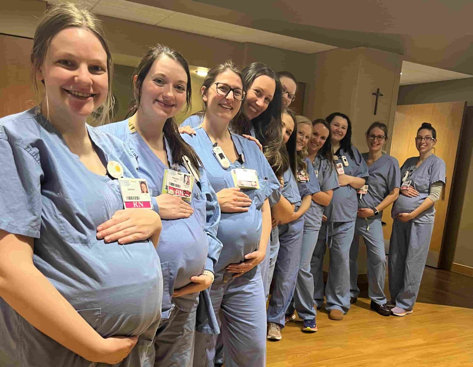 Fourteen nurses at HSHS St Vincent Hospital in Wisconsin are all pregnant at once - receiving care from their own colleagues in a heartwarming full circle maternity moment.