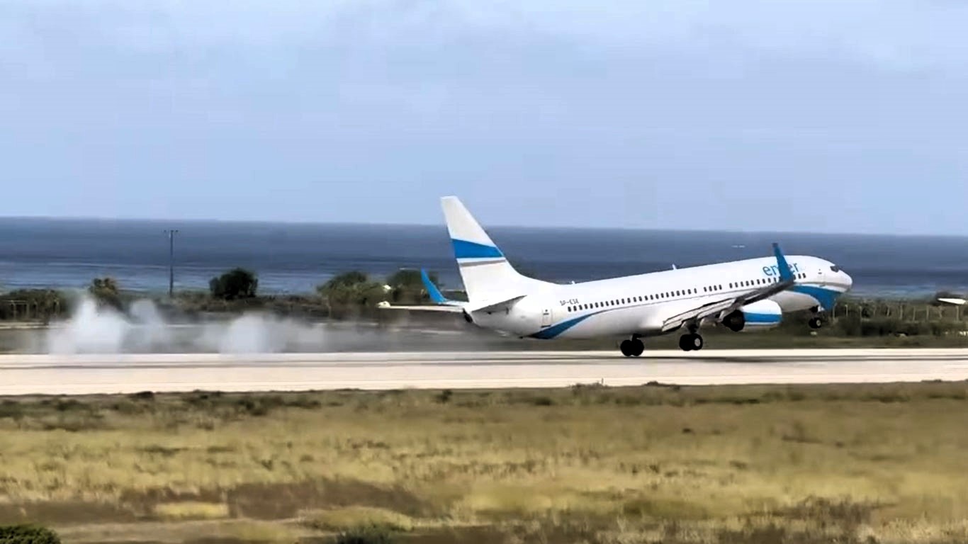 Passengers scream as Enter Air jet bounces on Rhodes runway during hard landing in 45kph crosswinds - pilot praised for avoiding disaster in viral video.