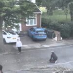 A man narrowly avoided injury as a massive tree branch crashed down just feet from him in Southall, west London. Locals helped clear the debris to keep the road safe.