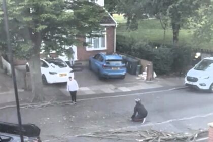 A man narrowly avoided injury as a massive tree branch crashed down just feet from him in Southall, west London. Locals helped clear the debris to keep the road safe.