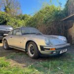 A dust-covered 1989 Porsche 911 Carrera Sport stored in a barn since 2011 has sold for £76,500 at auction, over triple its estimate, captivating collectors worldwide.