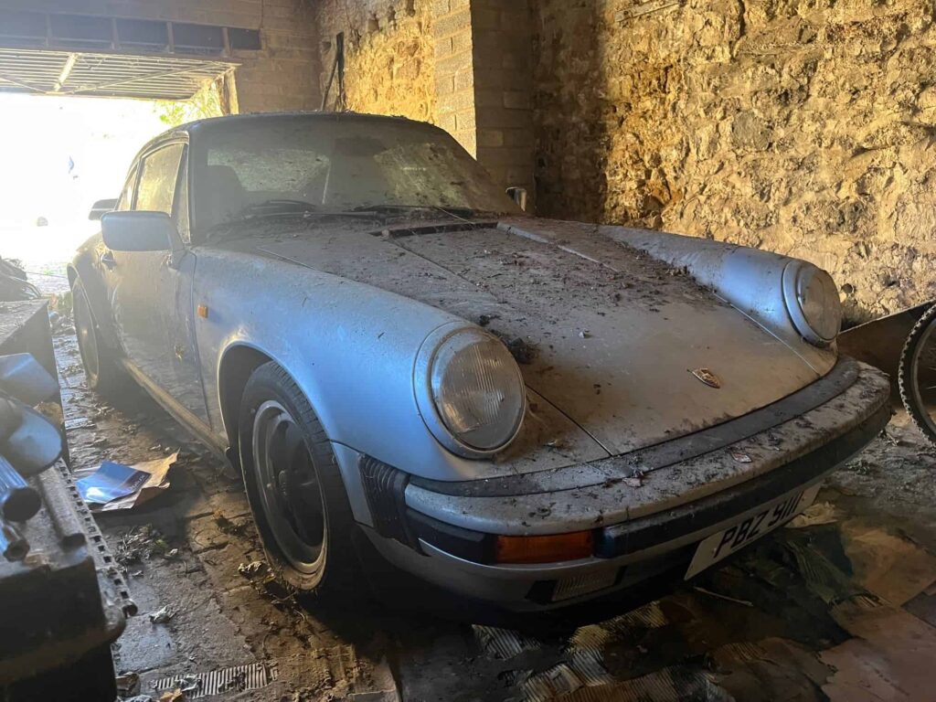 A dust-covered 1989 Porsche 911 Carrera Sport stored in a barn since 2011 has sold for £76,500 at auction, over triple its estimate, captivating collectors worldwide.