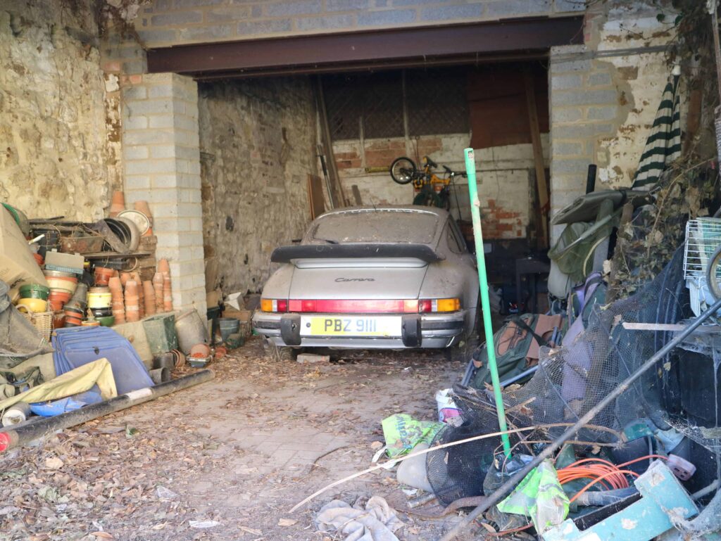 A dust-covered 1989 Porsche 911 Carrera Sport stored in a barn since 2011 has sold for £76,500 at auction, over triple its estimate, captivating collectors worldwide.