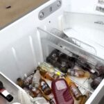 A flood victim found her fridge washed up 43 miles away on a beach in Australia with her beers still inside, amazingly intact after being swept away by floodwaters.