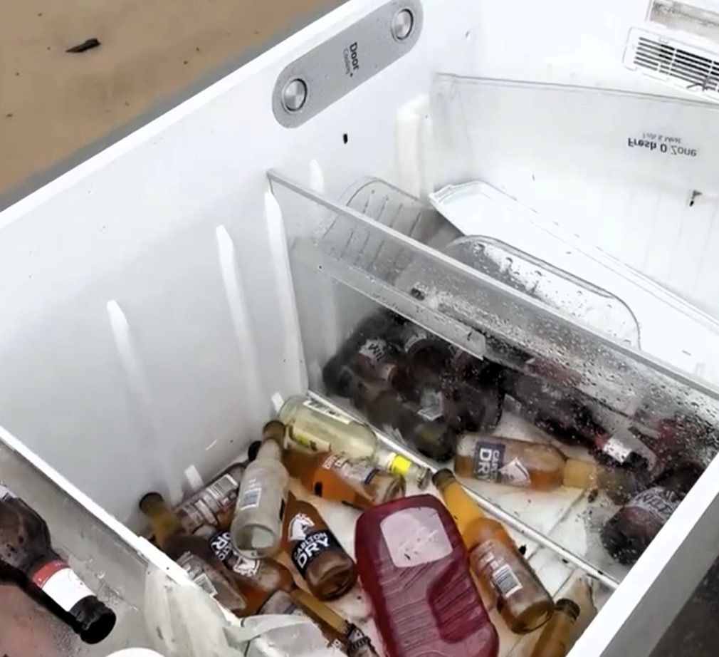 A flood victim found her fridge washed up 43 miles away on a beach in Australia with her beers still inside, amazingly intact after being swept away by floodwaters.