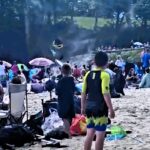 A rare dust devil stunned beachgoers at Coppet Hall Beach in Wales, as swirling sand lifted towels, clothes, and a surfboard into the air in a scene caught on camera.