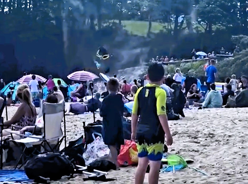 A rare dust devil stunned beachgoers at Coppet Hall Beach in Wales, as swirling sand lifted towels, clothes, and a surfboard into the air in a scene caught on camera.
