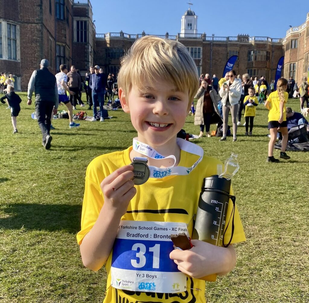 Seven-year-old Hugo Roth from Leeds broke the world record for his age by completing a 5K run in 20:59, inspired by the Brownlee Brothers and fuelled by boundless energy.